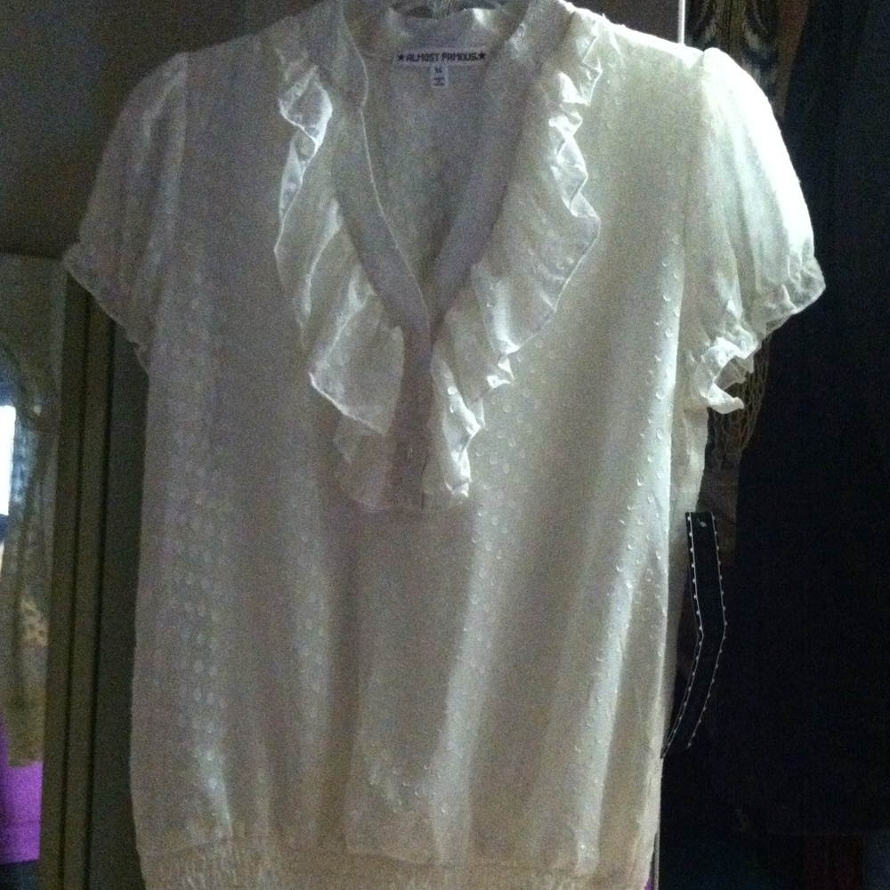 reducedBrand new with tags ruffle top